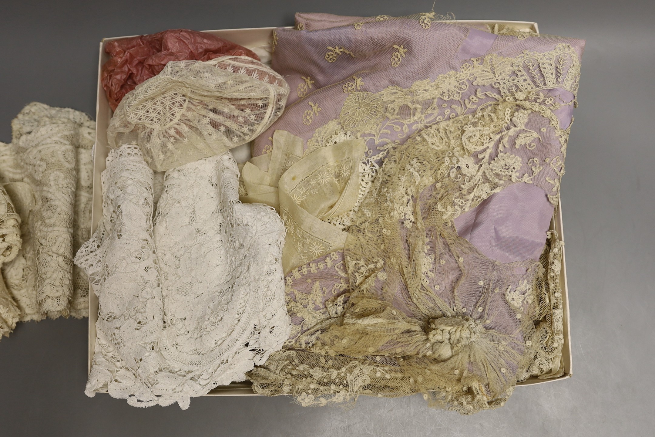 A Brussels mixed needlepoint lace cover, damaged a wide length of tape lace trim a similar collar, a later Honiton collar, a Scottish white worked hankie needlepoint baby bonnet and small Brussels collar